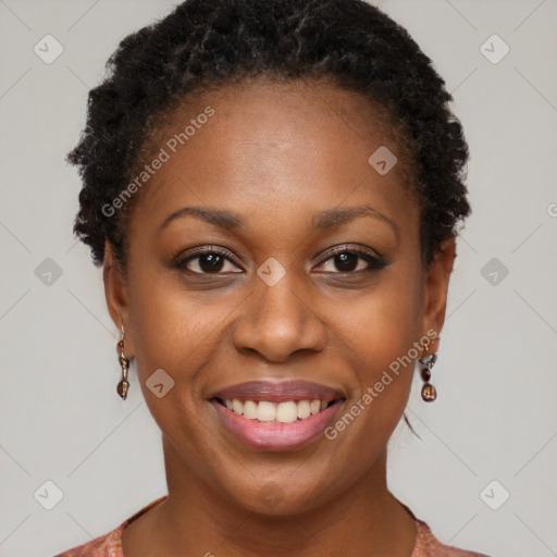 Joyful black young-adult female with short  brown hair and brown eyes