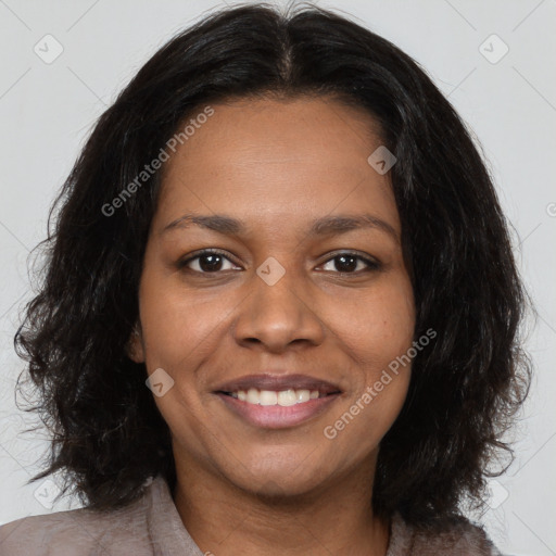 Joyful black young-adult female with medium  brown hair and brown eyes
