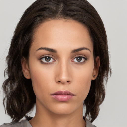 Neutral white young-adult female with medium  brown hair and brown eyes