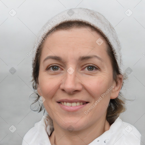 Joyful white adult female with medium  brown hair and grey eyes