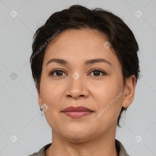 Joyful white adult female with medium  brown hair and brown eyes