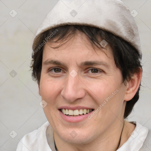 Joyful white adult female with medium  brown hair and brown eyes