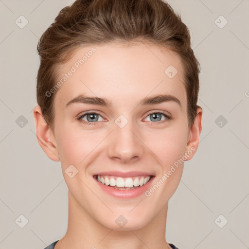 Joyful white young-adult female with short  brown hair and grey eyes