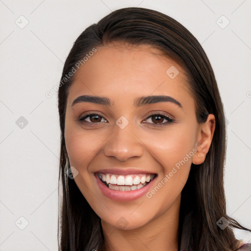 Joyful white young-adult female with long  black hair and brown eyes