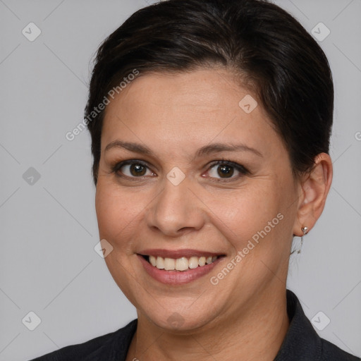 Joyful white adult female with medium  brown hair and brown eyes