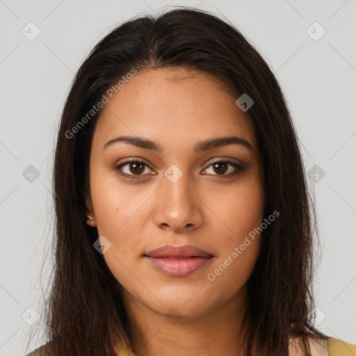 Joyful latino young-adult female with long  brown hair and brown eyes