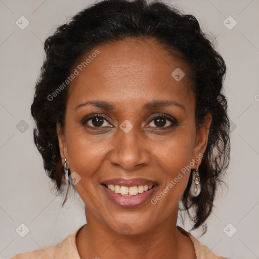 Joyful black adult female with medium  brown hair and brown eyes