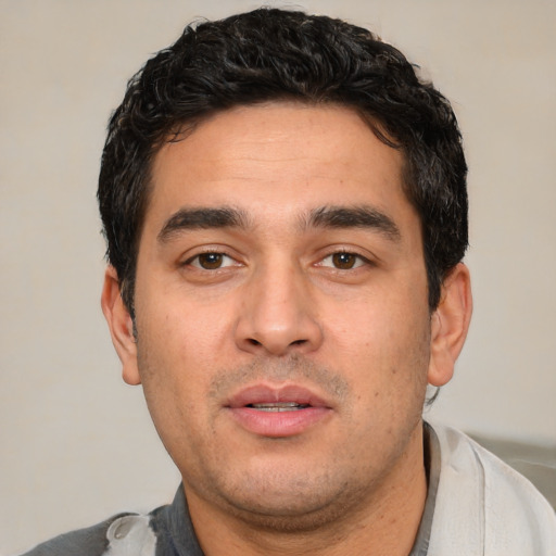 Neutral white young-adult male with short  black hair and brown eyes