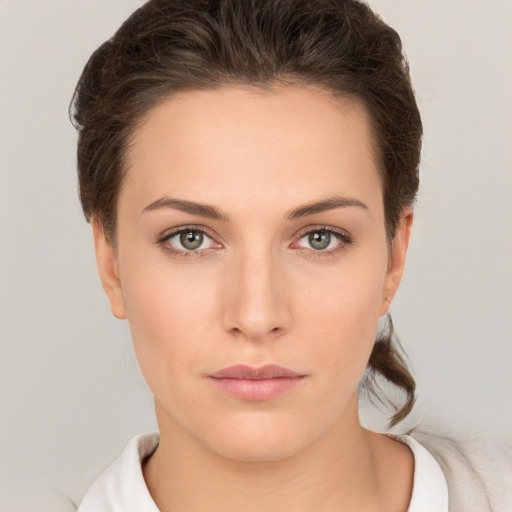 Neutral white young-adult female with short  brown hair and brown eyes