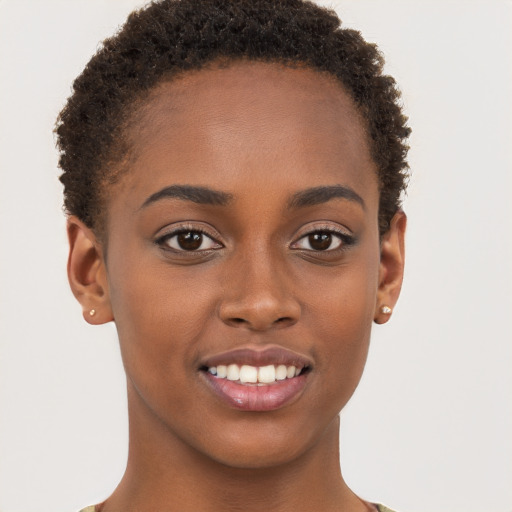 Joyful black young-adult female with short  brown hair and brown eyes