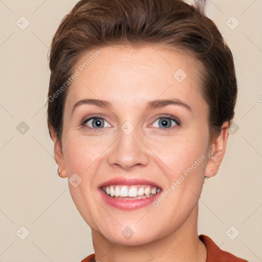 Joyful white young-adult female with short  brown hair and grey eyes