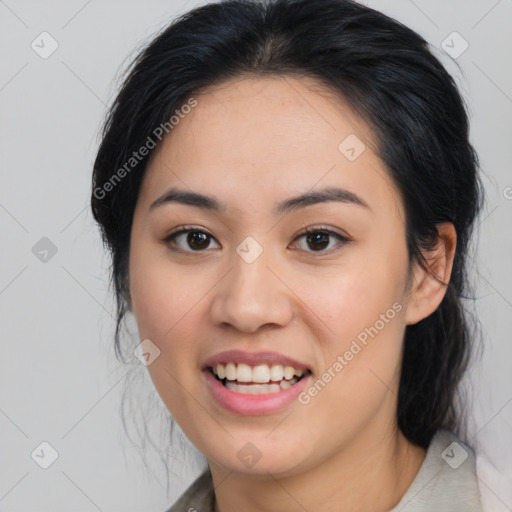 Joyful asian young-adult female with medium  black hair and brown eyes