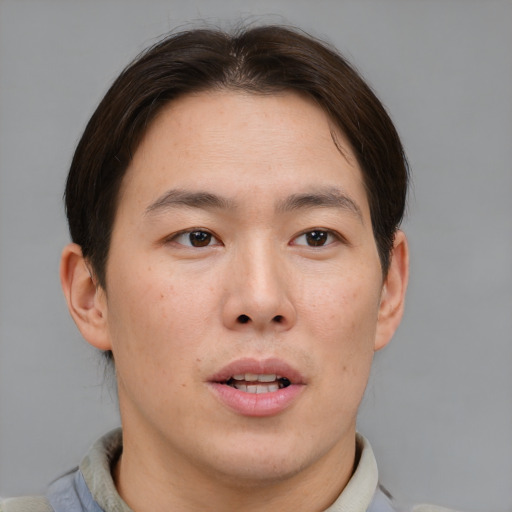 Neutral asian young-adult male with short  brown hair and brown eyes