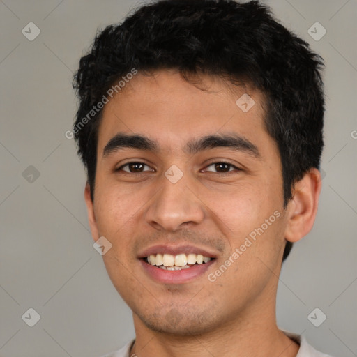 Joyful latino young-adult male with short  black hair and brown eyes