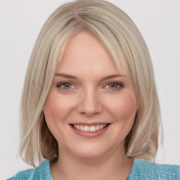 Joyful white young-adult female with medium  brown hair and blue eyes