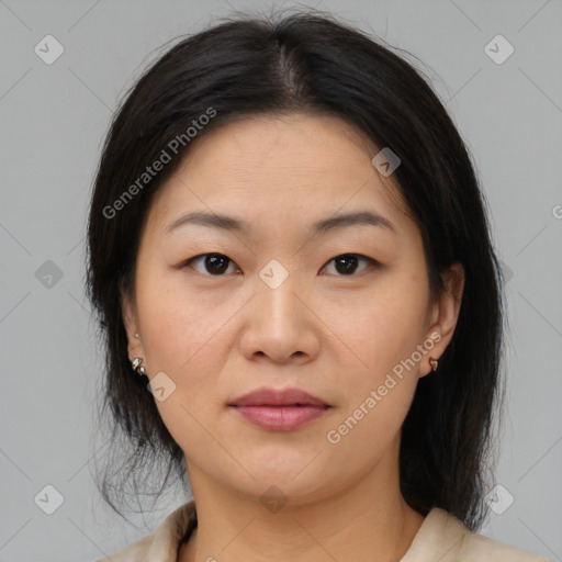 Joyful asian young-adult female with medium  brown hair and brown eyes