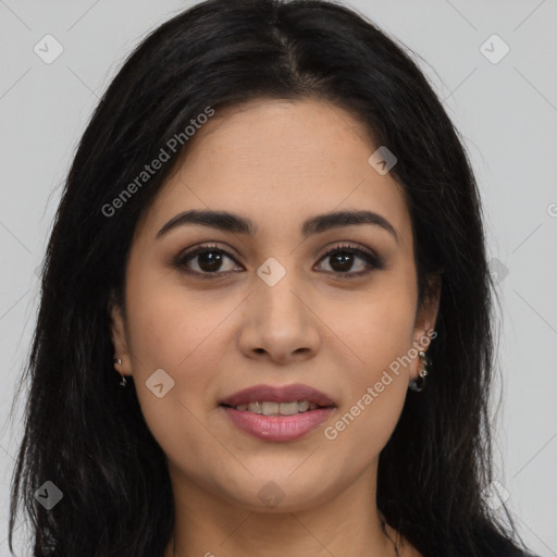 Joyful latino young-adult female with long  brown hair and brown eyes