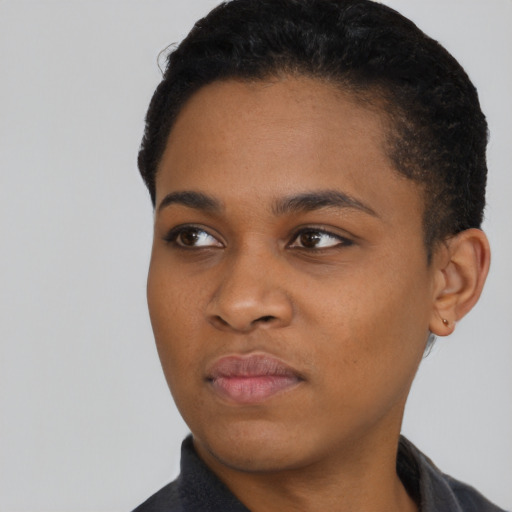 Neutral black young-adult female with short  black hair and brown eyes