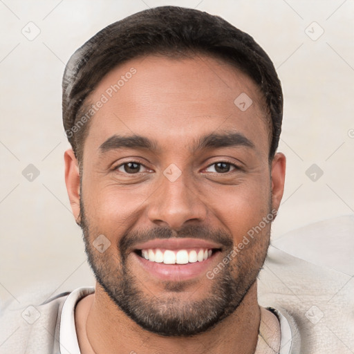 Joyful white young-adult male with short  brown hair and brown eyes