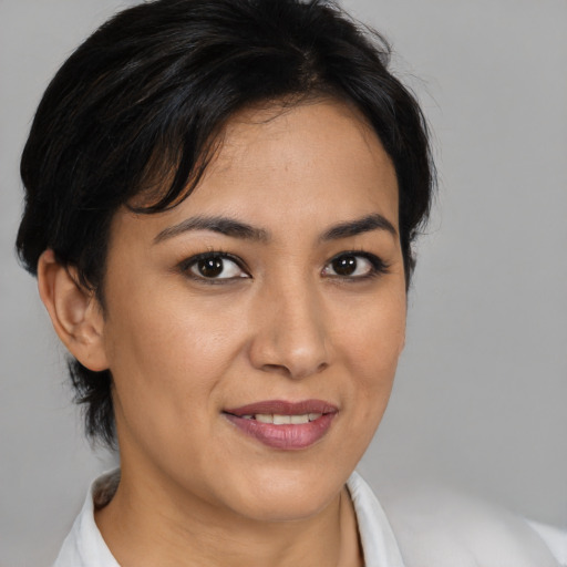 Joyful asian young-adult female with medium  brown hair and brown eyes