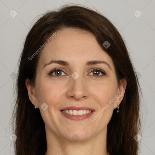 Joyful white adult female with long  brown hair and brown eyes