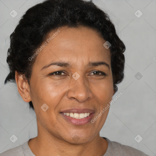 Joyful latino adult female with short  brown hair and brown eyes