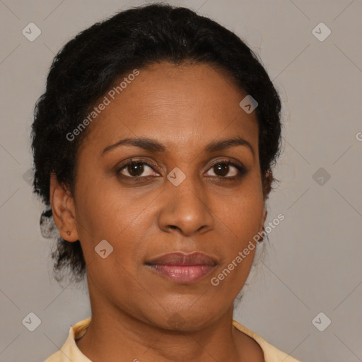 Joyful black adult female with short  brown hair and brown eyes