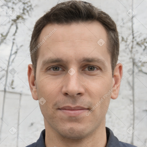 Joyful white adult male with short  brown hair and grey eyes