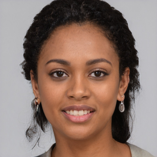 Joyful latino young-adult female with long  black hair and brown eyes