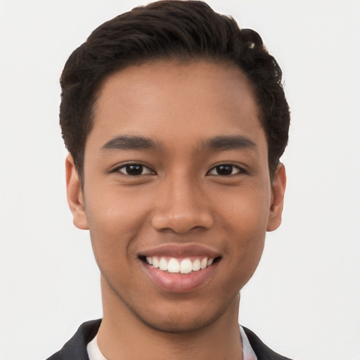 Joyful latino young-adult male with short  brown hair and brown eyes