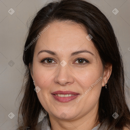 Joyful white adult female with medium  brown hair and brown eyes