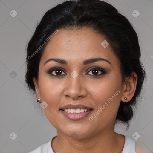 Joyful latino young-adult female with medium  brown hair and brown eyes