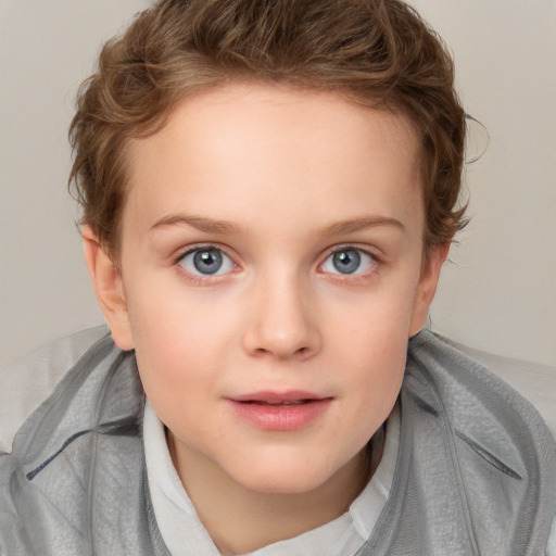 Joyful white child female with short  brown hair and blue eyes