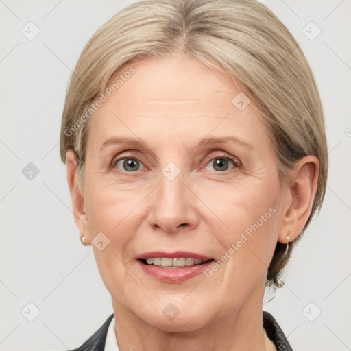 Joyful white adult female with medium  brown hair and grey eyes