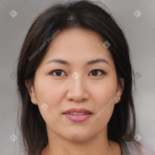 Joyful asian young-adult female with medium  brown hair and brown eyes