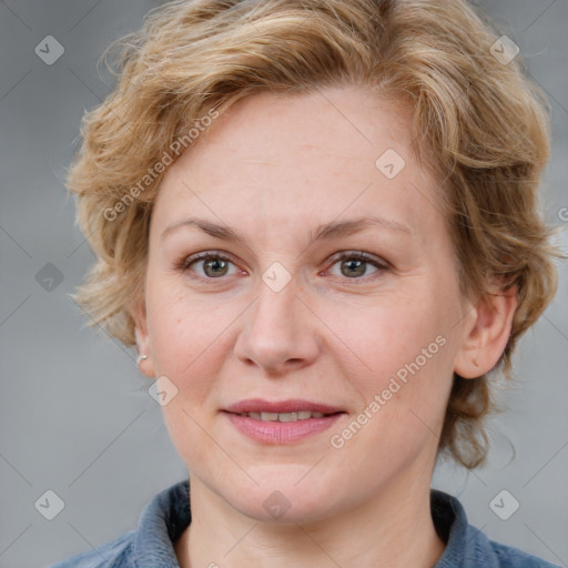 Joyful white adult female with medium  brown hair and blue eyes