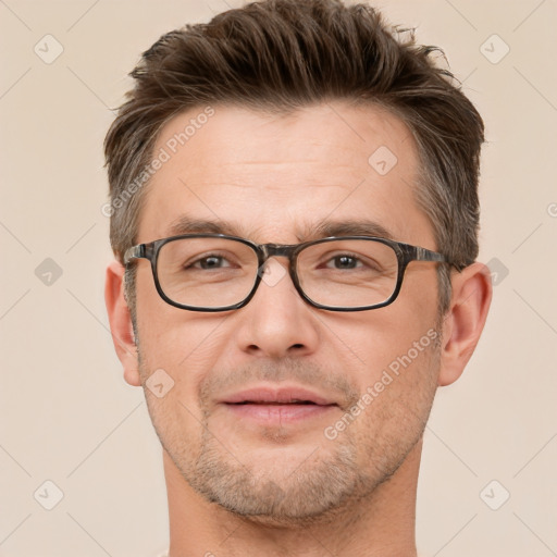 Joyful white adult male with short  brown hair and brown eyes