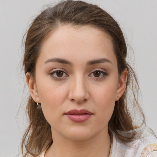 Neutral white young-adult female with medium  brown hair and brown eyes