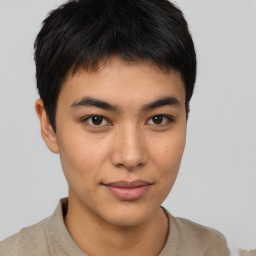 Joyful latino young-adult male with short  brown hair and brown eyes