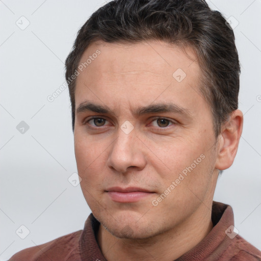 Joyful white adult male with short  brown hair and brown eyes