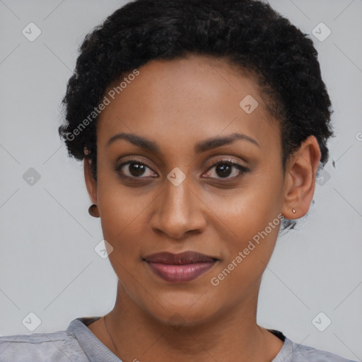 Joyful black young-adult female with short  black hair and brown eyes