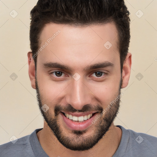 Joyful white young-adult male with short  black hair and brown eyes