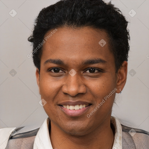 Joyful black young-adult male with short  brown hair and brown eyes