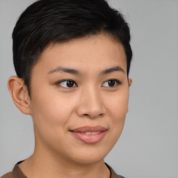 Joyful asian young-adult female with short  brown hair and brown eyes