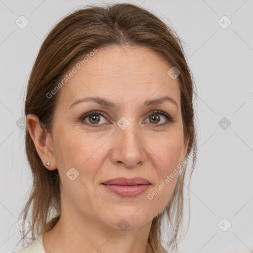 Joyful white adult female with medium  brown hair and grey eyes