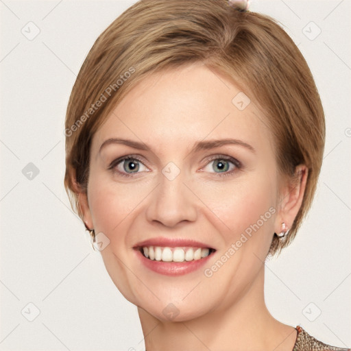 Joyful white young-adult female with short  brown hair and grey eyes