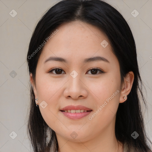 Joyful asian young-adult female with long  black hair and brown eyes