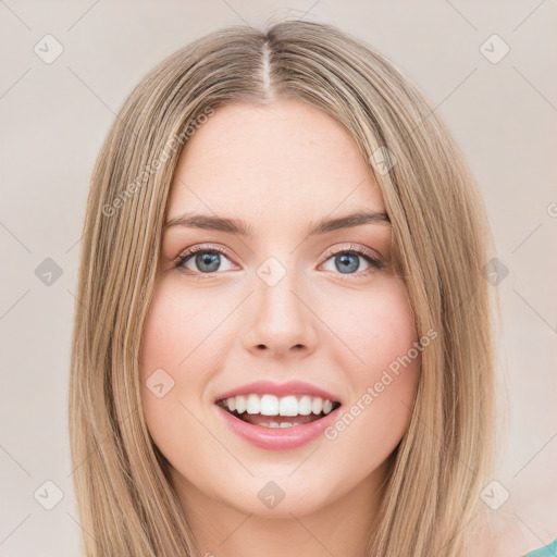 Joyful white young-adult female with long  brown hair and green eyes