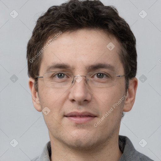 Joyful white adult male with short  brown hair and grey eyes