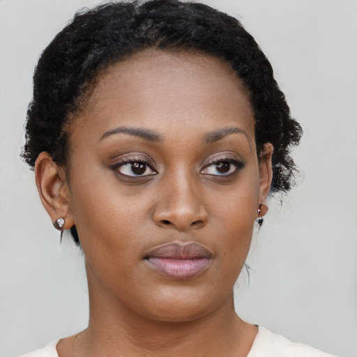 Neutral black young-adult female with short  brown hair and brown eyes